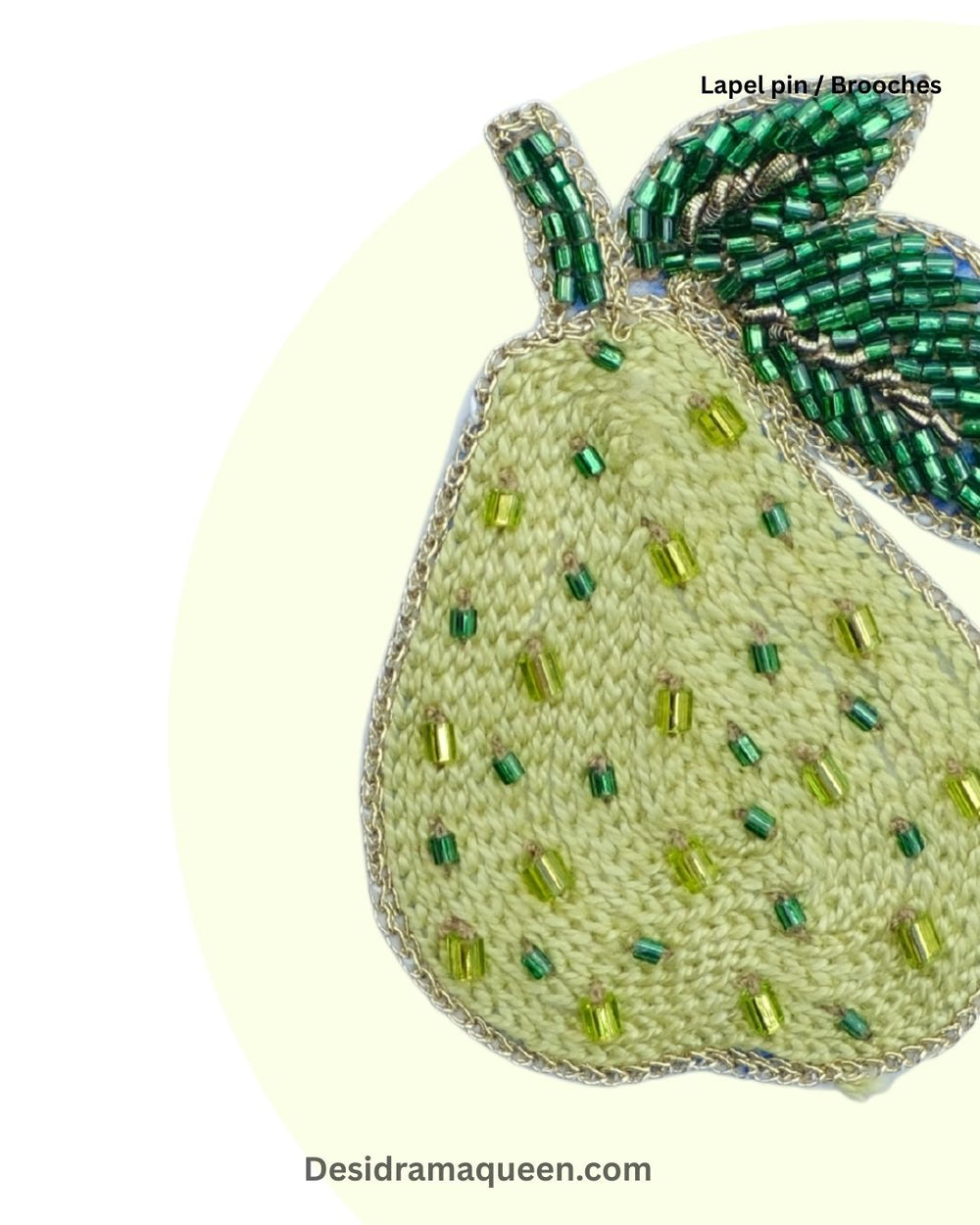Handmade pear brooch with beaded embroidery and green leaf design, unique fruit-inspired lapel pin.