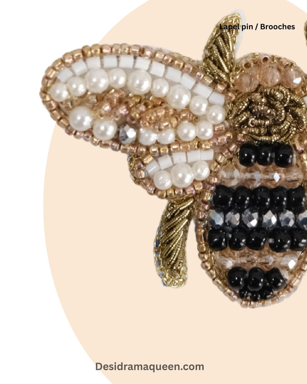 Handcrafted bee brooch with gold, black, and pearl beads, unique insect lapel pin accessory.