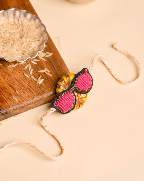 Rakhi Magnet- Yellow ring with Pink Chashma