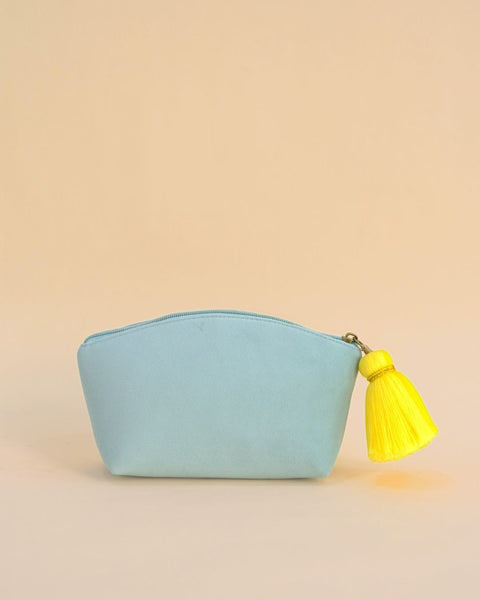 Cute blue pouch decorated with yellow banana embroidery and tassel detail, handmade makeup and travel bag.