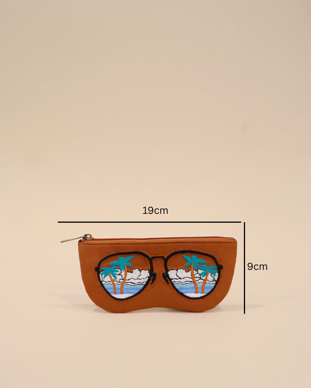 Brown  sunglasses cover with embroidered tropical scenery featuring palm trees, ocean waves, and clouds, creating a vacation-inspired design.