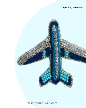 Unique airplane brooch crafted with detailed bead embroidery, aviation-inspired handmade lapel pin gift for travelers.