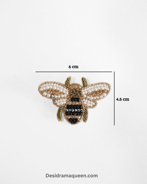 Handmade bee brooch with black and white beaded wings