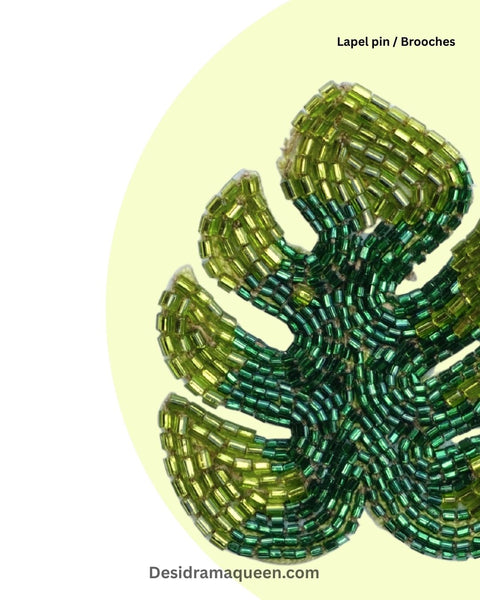 Embroidered green leaf brooch with bead detailing, handmade monstera lapel pin for nature-inspired fashion accessories.