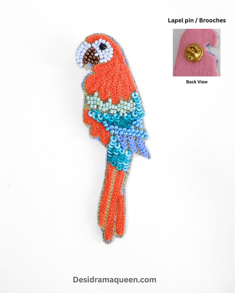 Vibrant handmade parrot brooch with bead and sequin detailing, tropical bird lapel pin accessory for fashion lovers.