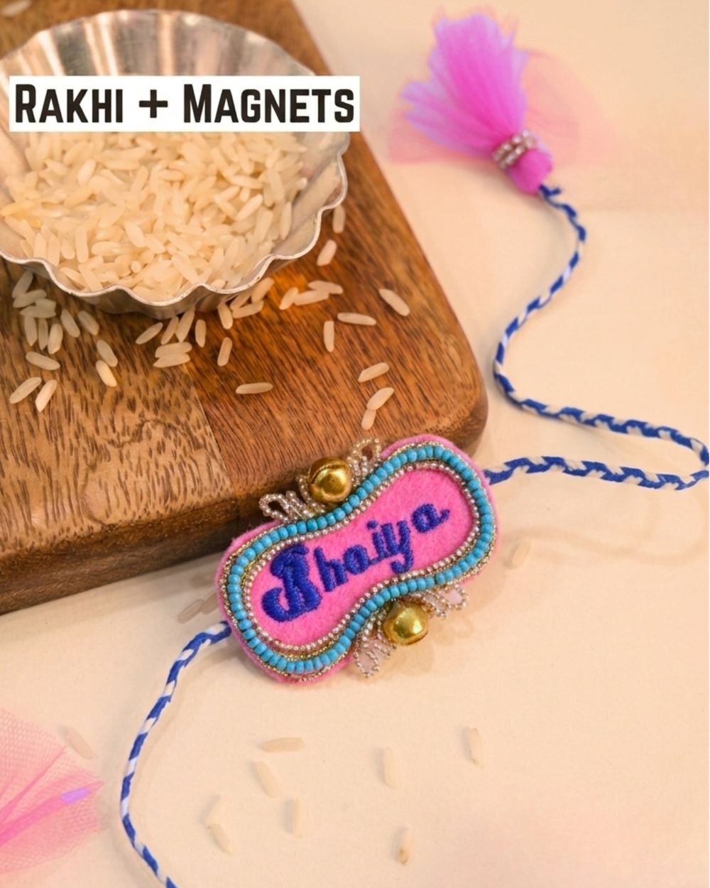 Bhaiya embroidered rakhi magnet placed beside a bowl of rice, styled for a festive Raksha Bandhan celebration.
