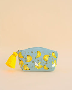 Blue makeup pouch with embroidered banana designs and yellow tassel zipper, handmade cosmetic bag for travel and daily use.