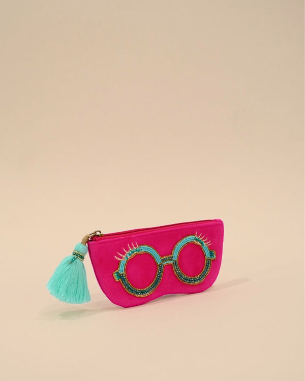 Vibrant hot pink sunglass cover with round beaded spectacle embroidery and turquoise tassel zipper, stylish handmade pouch for travel accessories.
