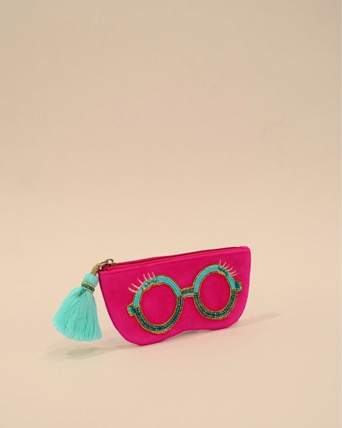 Vibrant hot pink sunglass cover with round beaded spectacle embroidery and turquoise tassel zipper, stylish handmade pouch for travel accessories.