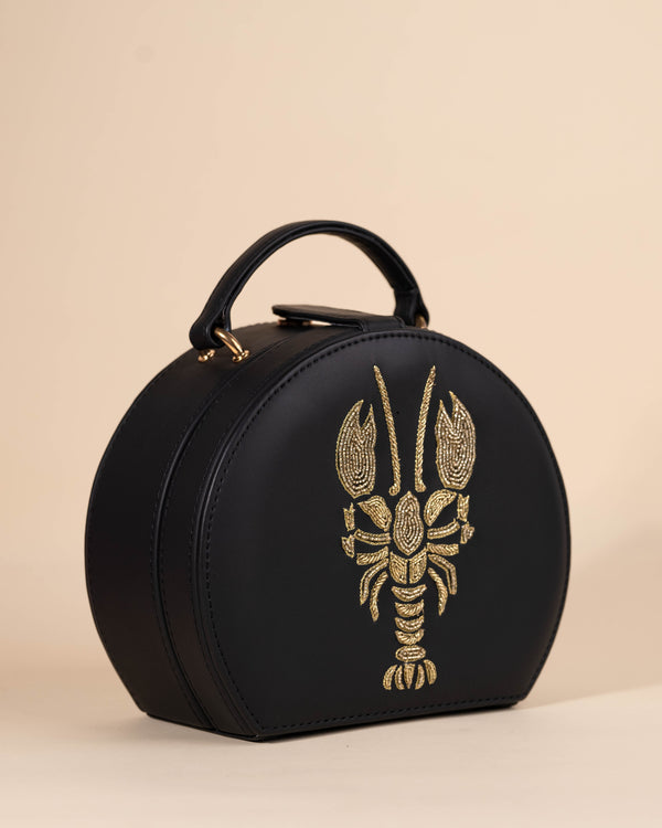 Women's box-style sling bag with beadwork, zari hand embroidery, and gold accents
