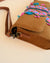 Bohemian style sling bag with floral embroidery and tassel details