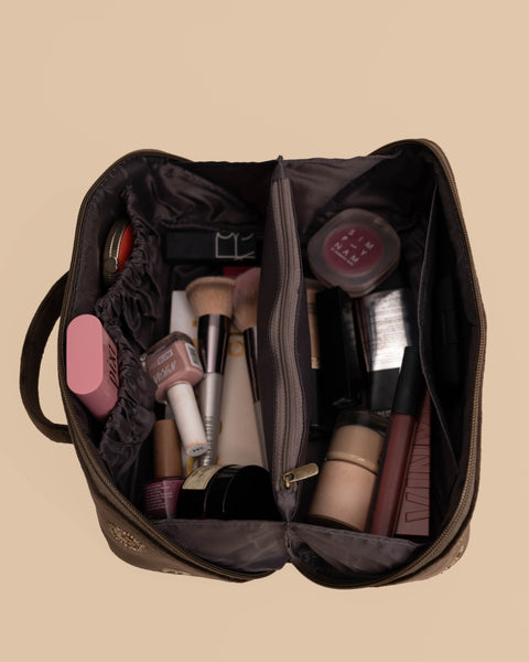 Spacious brown makeup pouch featuring celestial embroidery, perfect cosmetic bag for travel and daily use.