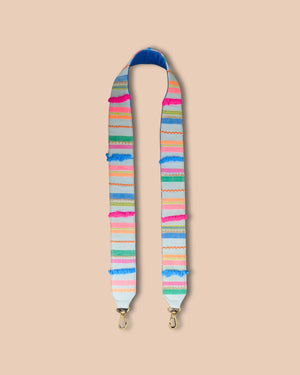Multicolored striped bag strap on a beige background
