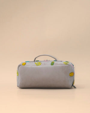 Back view of the Cactus Sand Shell Makeup Pouch crafted from premium light grey fabric with a clean minimalist finish, sturdy carry handle, and roomy zippered design for everyday use