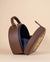 Leopard-themed sling bag with gold zari embroidery and handcrafted bead accents
