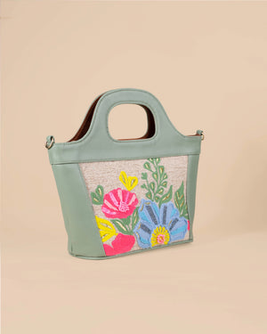 Handbag with floral design on a beige background