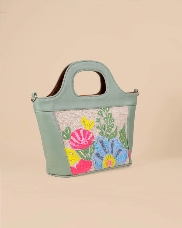 Handbag with floral design on a beige background