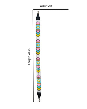 Colorful geometric patterned strap with black ends on a beige background