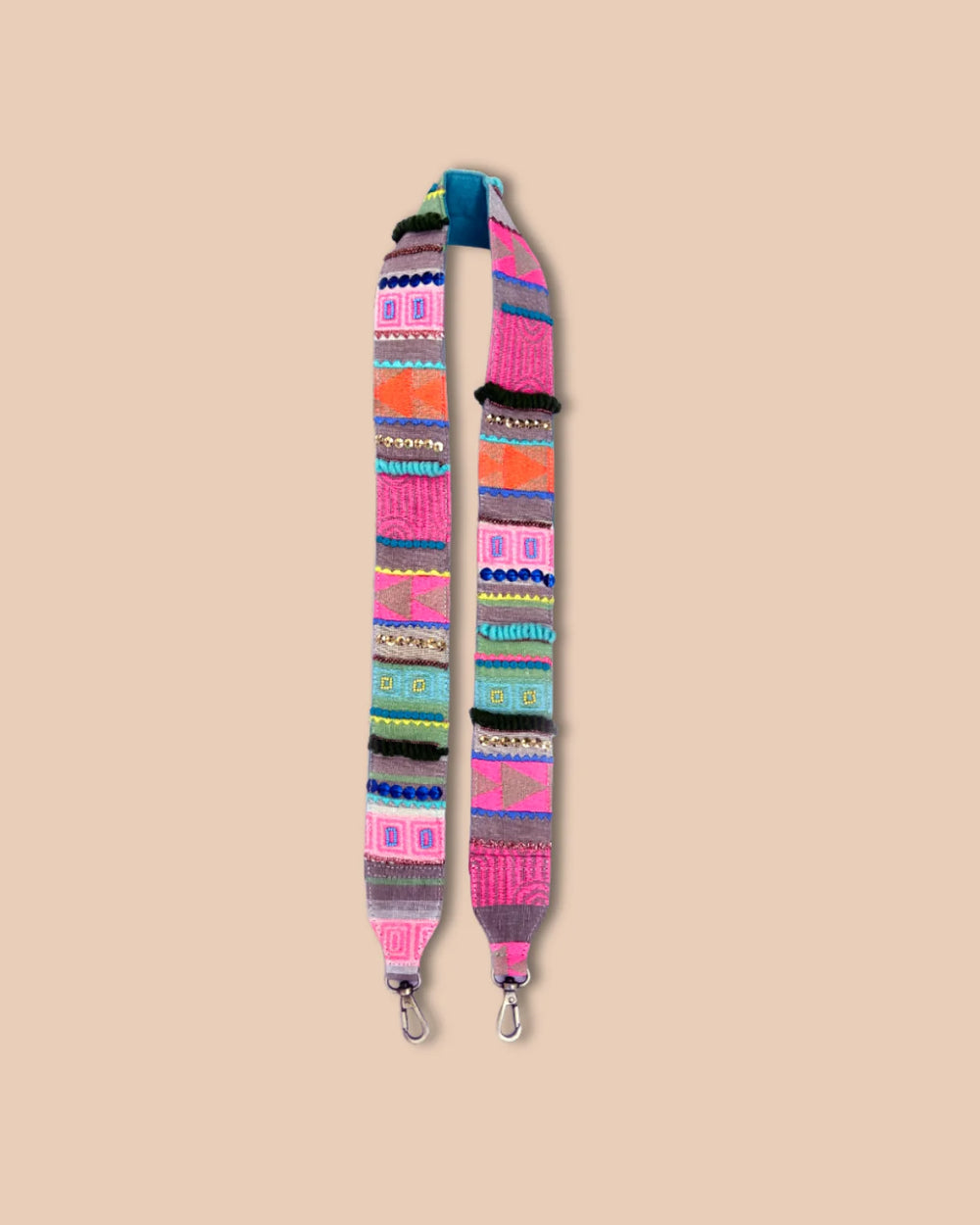 Colorful patterned strap on a beige background