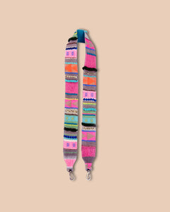 Colorful patterned strap on a beige background