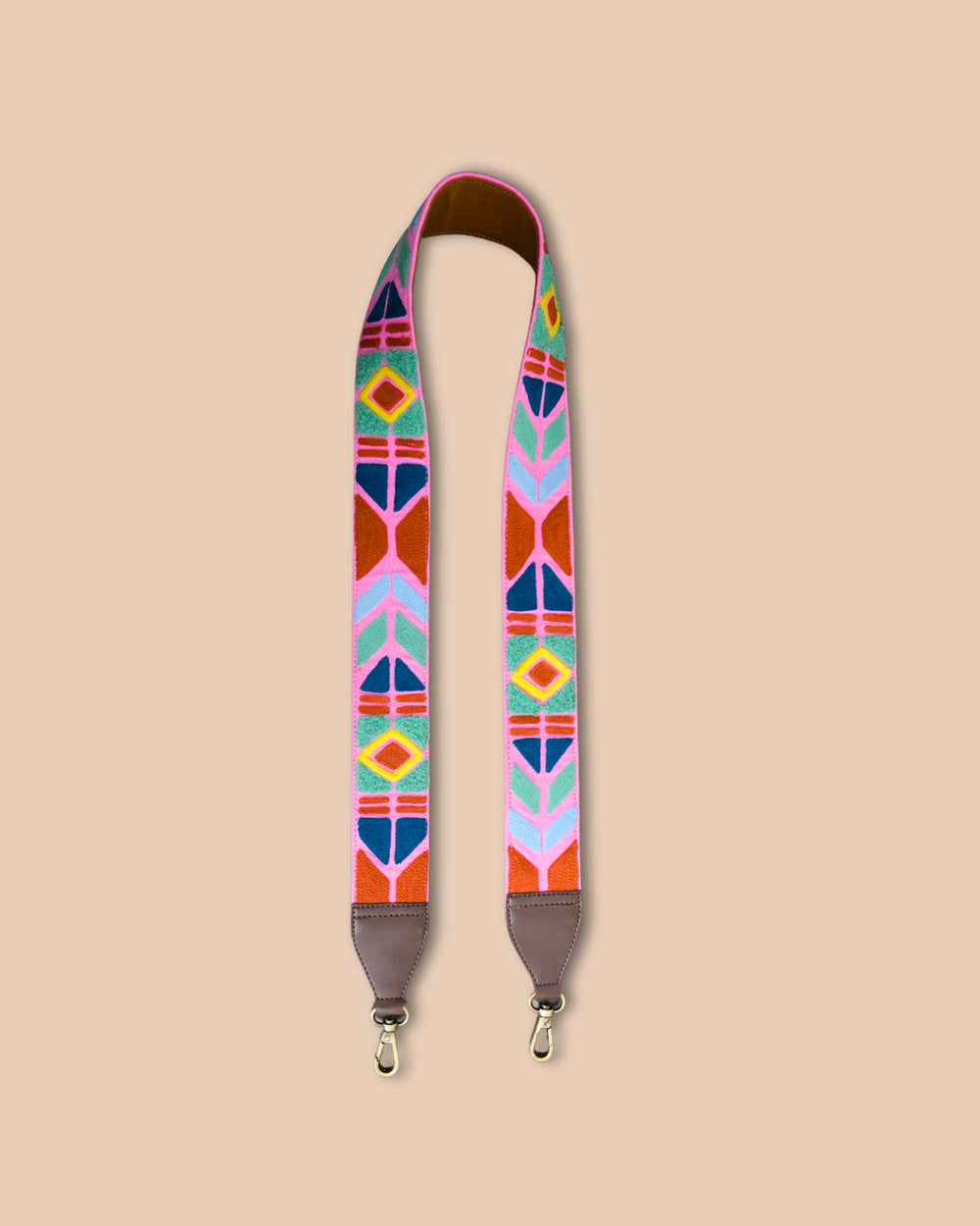 Colorful geometric-patterned strap on a beige background