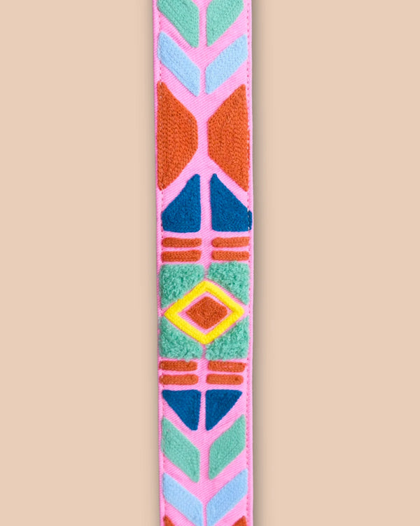 Colorful geometric patterned belt on a beige background