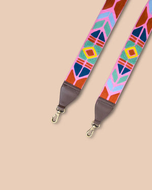 Colorful strap with geometric pattern on a beige background