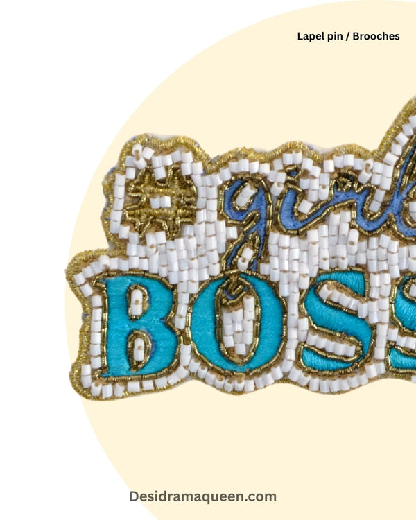 Unique handmade Girl Boss brooch with beads, sequins, and turquoise embroidery for women empowerment fashion.