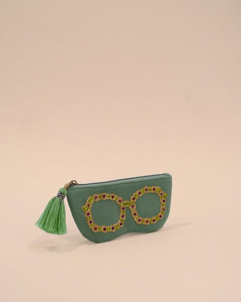 Green sunglass cover with bead embroidery in gold, purple, and green tones, handmade eyewear case with tassel detail.