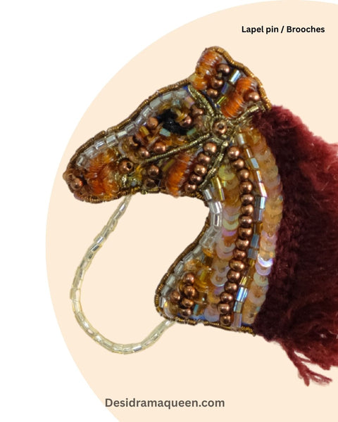 Brown and gold beaded horse brooch with maroon mane, handmade equestrian-inspired lapel accessory.
