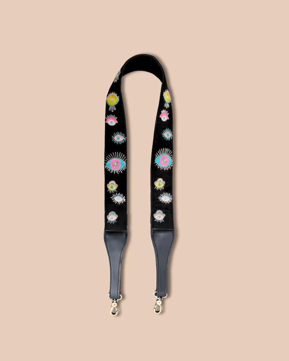 Floral patterned strap with gray ends on a beige background
