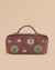 Dusty mauve makeup pouch with colorful evil eye embroidery, featuring zipper closure and top handle.