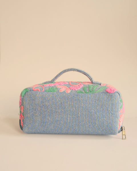 Pastel embroidered makeup pouch featuring floral patterns, durable and spacious cosmetic bag.