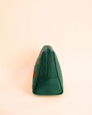 Green makeup pouch with strawberry embroidery and pink tassel zipper, handmade cosmetic bag for quirky fashion lovers.