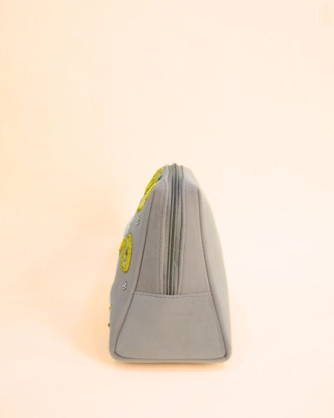 Grey makeup pouch with vibrant yellow lemon embroidery and tassel zipper, handmade cosmetic and travel bag.