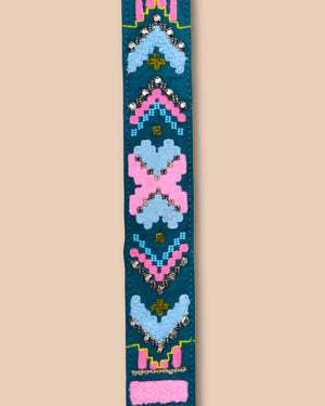 Decorative belt with colorful patterns on a beige background