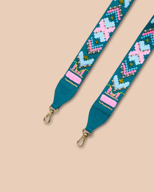 Teal strap with colorful butterfly design on a beige background