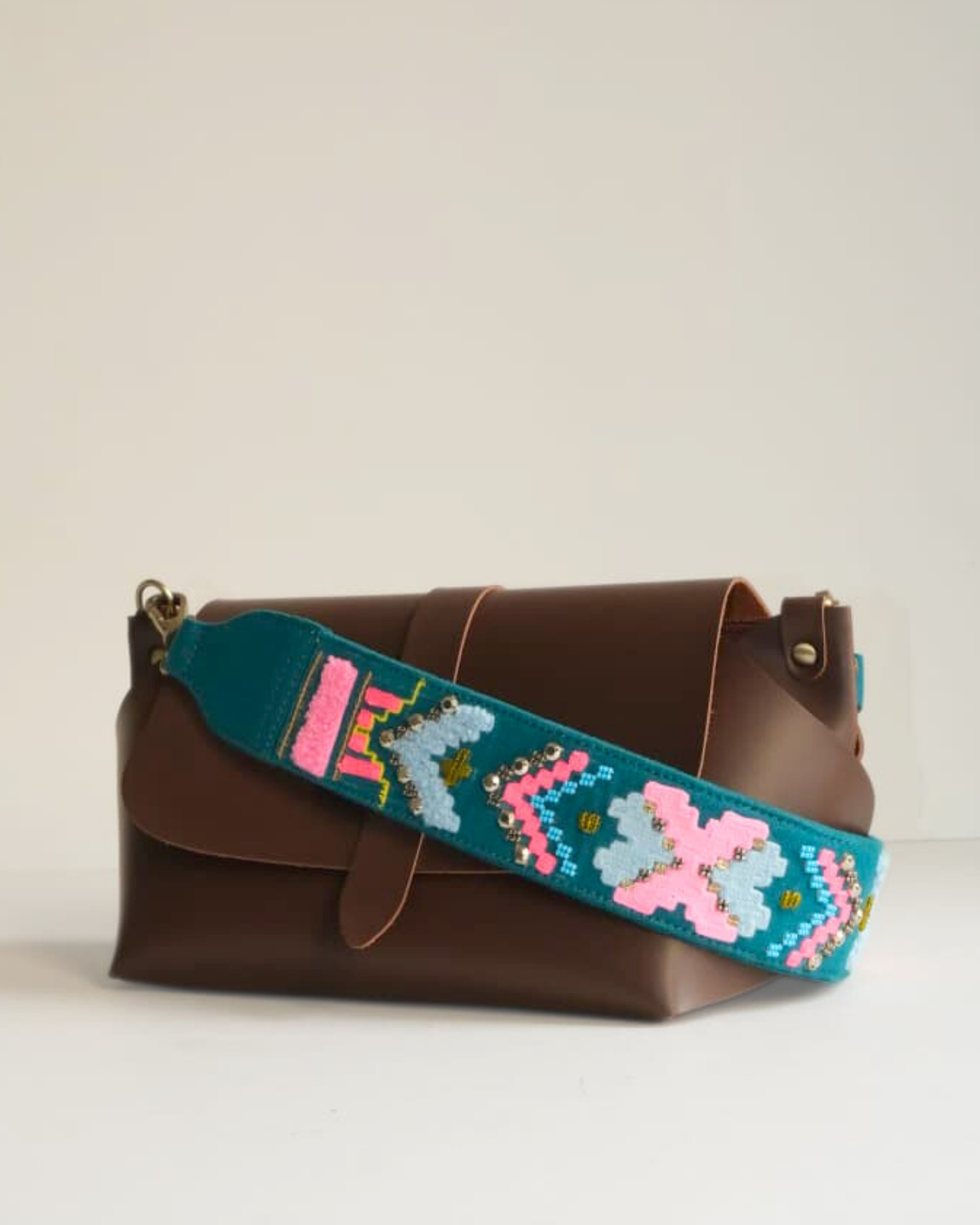 SLING BAG BROWN WITH GEOPOP TEAL EMBROIDERED STRAP