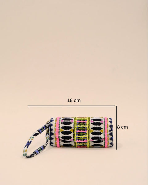 Cylindrical sunglass cover with a wrist strap, featuring bold geometric embroidery in black, white, pink, yellow, and green, creating a vibrant and stylish design