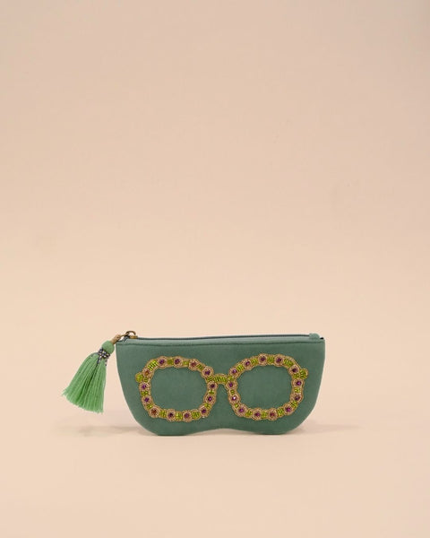 Green sunglass cover with round spectacle embroidery in golden, purple, and green beadwork, handmade pouch with tassel zipper.