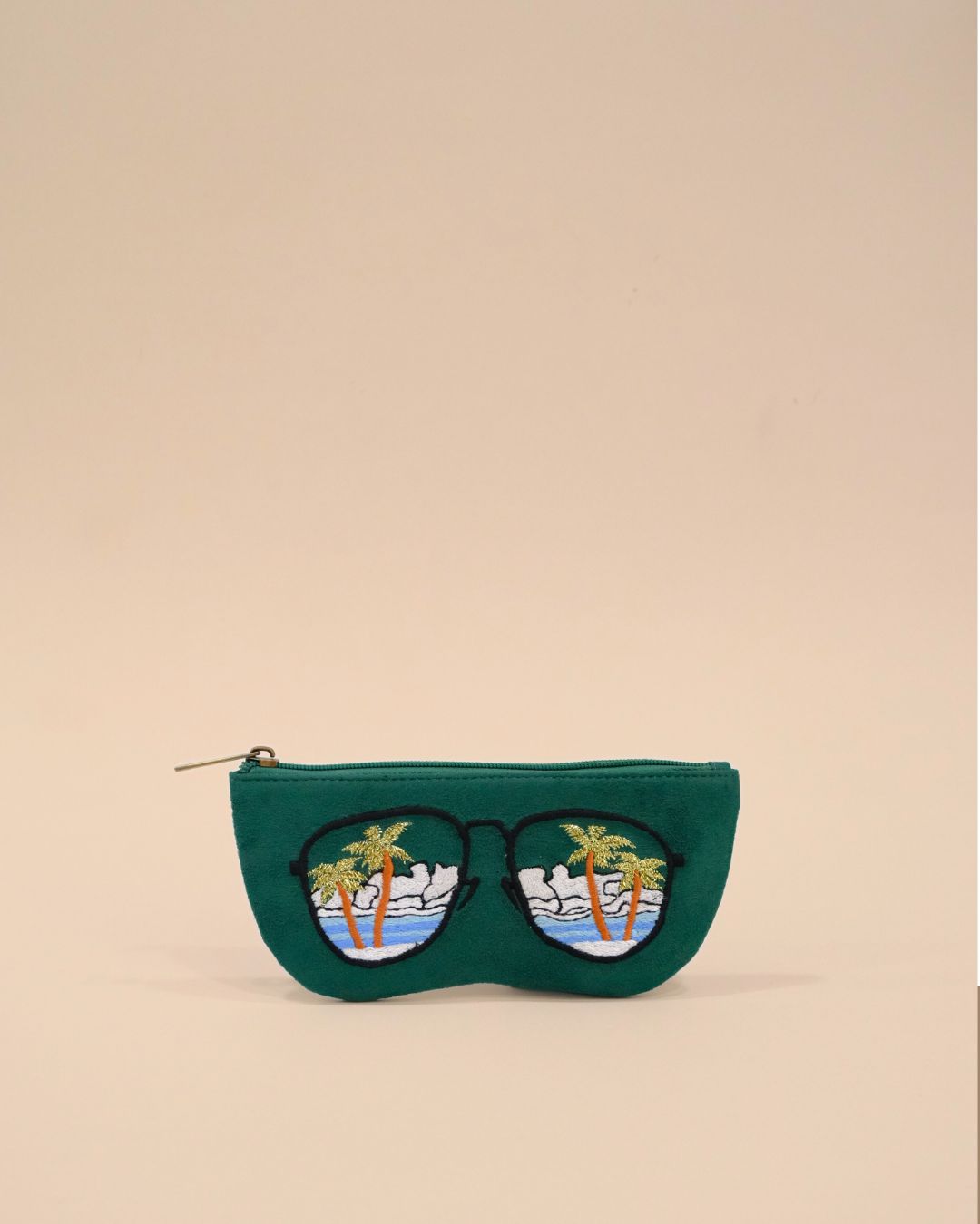Green sunglass cover with embroidered palm trees, ocean waves, and sky reflected in sunglasses design, handmade tropical eyewear pouch.