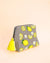 Handmade grey pouch with embroidered lemons, white flowers, and yellow tassel, cosmetic bag for daily use.