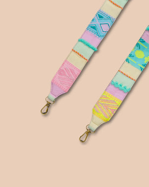 Colorful strap with geometric pattern on a beige background