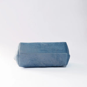 Blue denim pouch on a white background