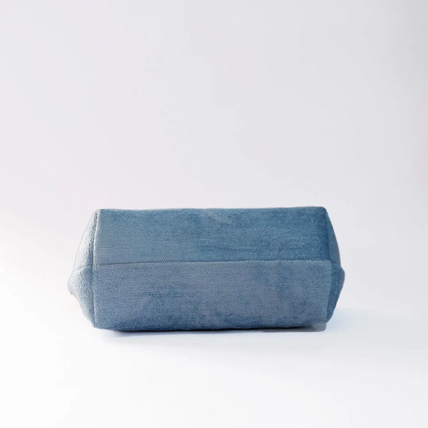 Blue denim pouch on a white background