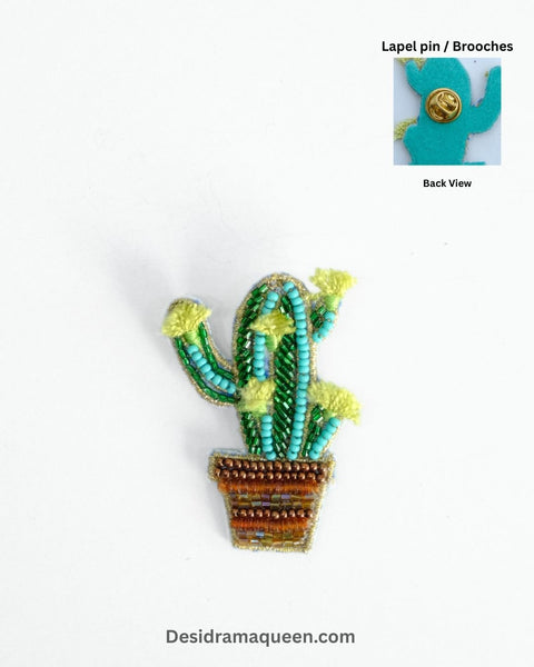 Handcrafted cactus brooch with green and yellow bead embroidery in a brown beaded pot, unique lapel pin design.