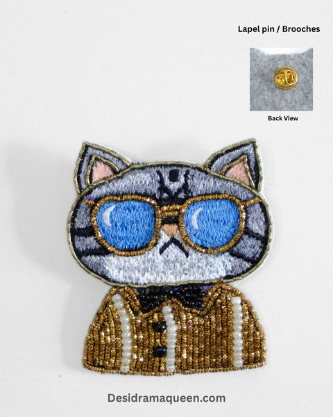 Handmade embroidered cat brooch with golden sunglasses and tuxedo design – quirky beaded fashion accessory for cat lovers.