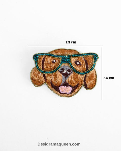 Brown dog brooch wearing teal sunglasses, handmade with bead embroidery, quirky animal lapel pin for jackets, shirts, and bags