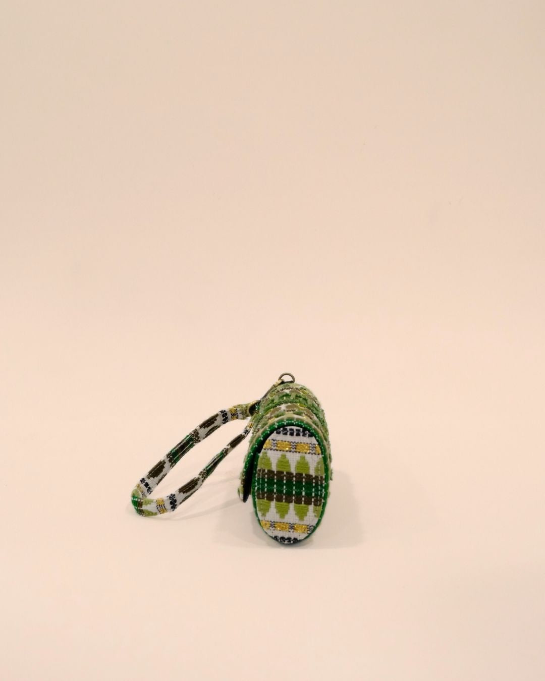 Green tribal embroidered sunglass case with olive and golden detailing, handmade eyewear pouch with strap.