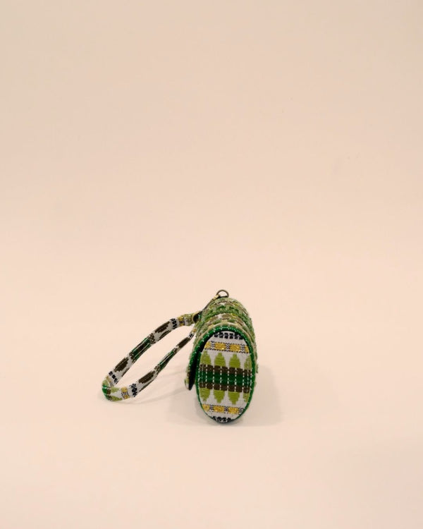 Green tribal embroidered sunglass case with olive and golden detailing, handmade eyewear pouch with strap.